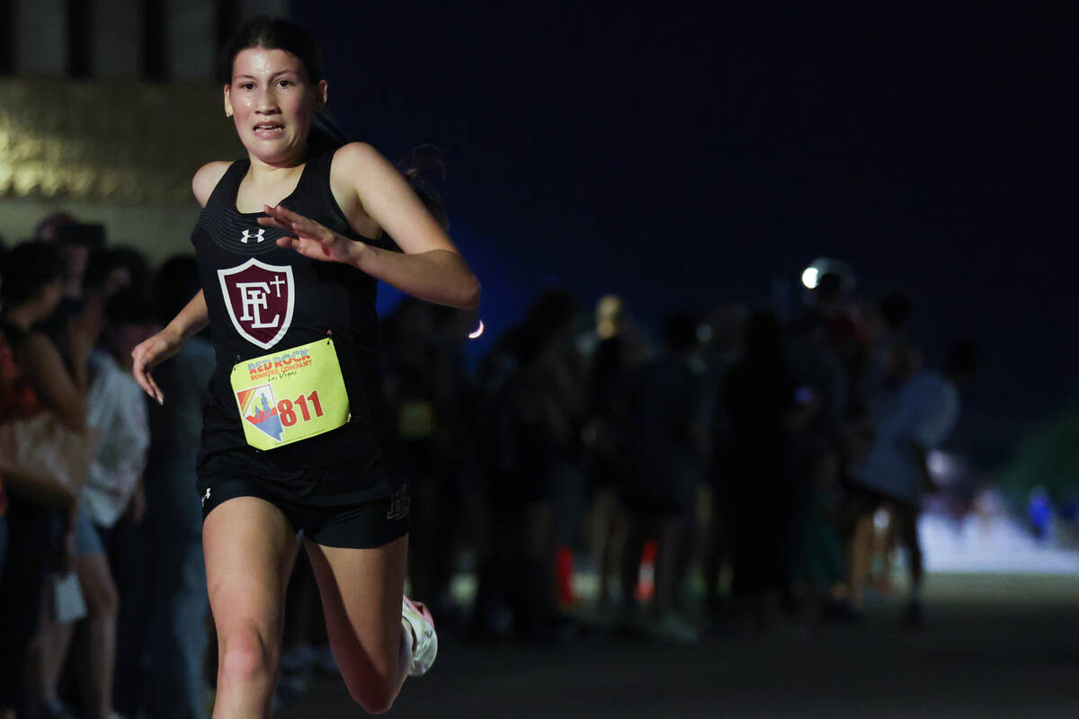 Faith Lutheran’s Scarlett Cotrone crosses the finish line during the Red Rock Running Co ...