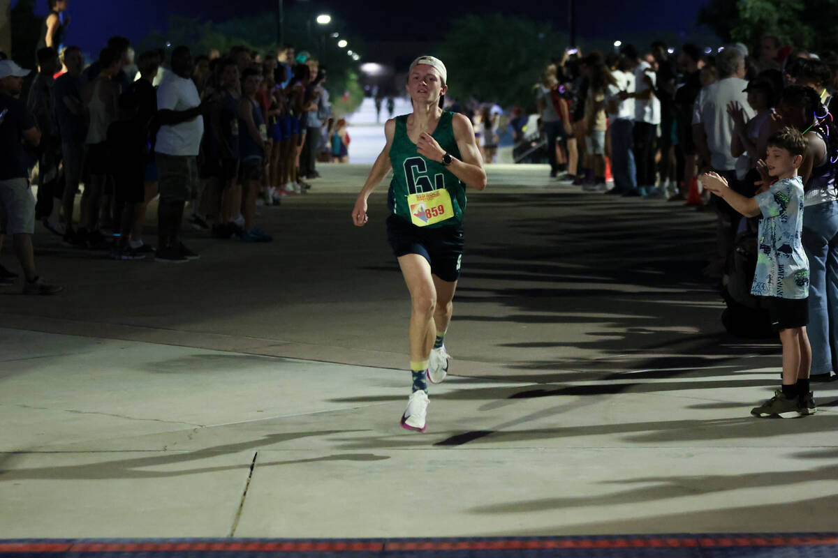 Green Valley’s Andrew Poirier reaches the finish line during the Red Rock Running Compan ...