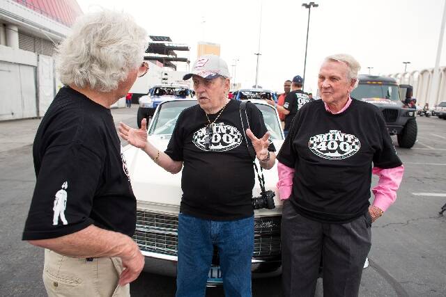 The Mint 400 founders Norm Johnson, center, and Mel Larson, right, talk on March 22, 2013, with ...