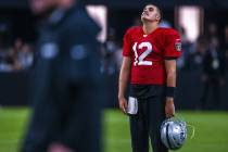 Raiders quarterback Aidan O'Connell (12) appears a bit dejected during an open practice at Alle ...