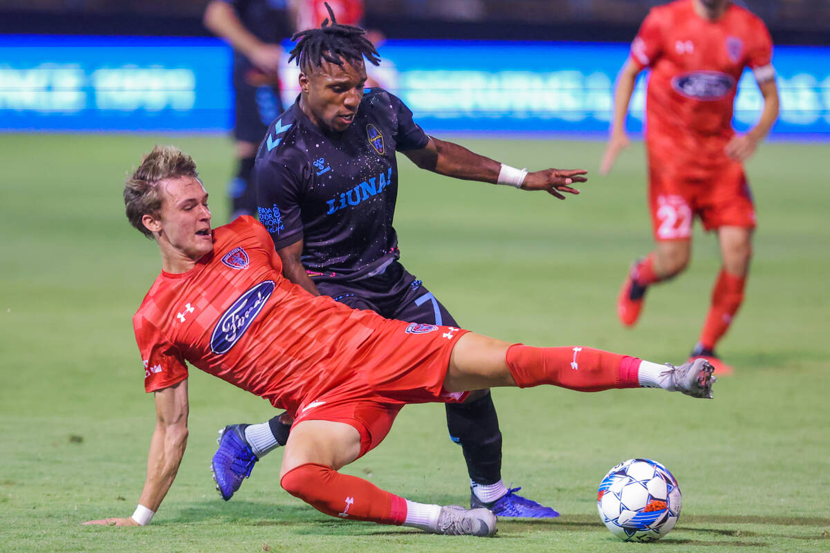 Lights FC midfielder Joseph-Claude Gyau (7) and Indy Eleven defender Logan Neidlinger (37) rac ...