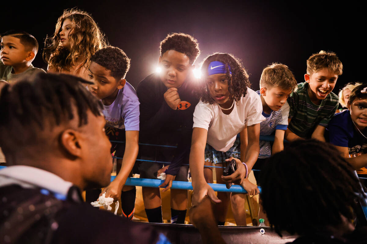 Lights FC fans eagerly ask for autographs and photographs following a soccer game between the L ...