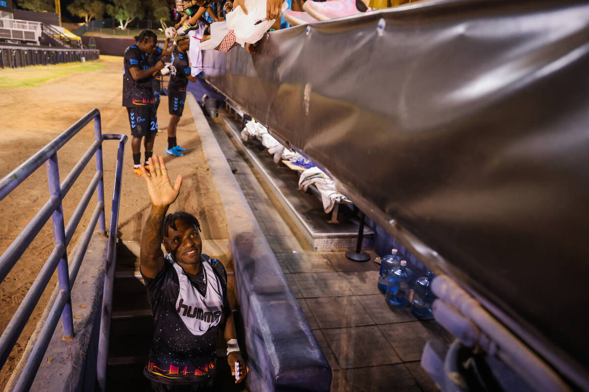 Lights FC midfielder Joseph-Claude Gyau waves to fans as he leaves the field after a soccer gam ...