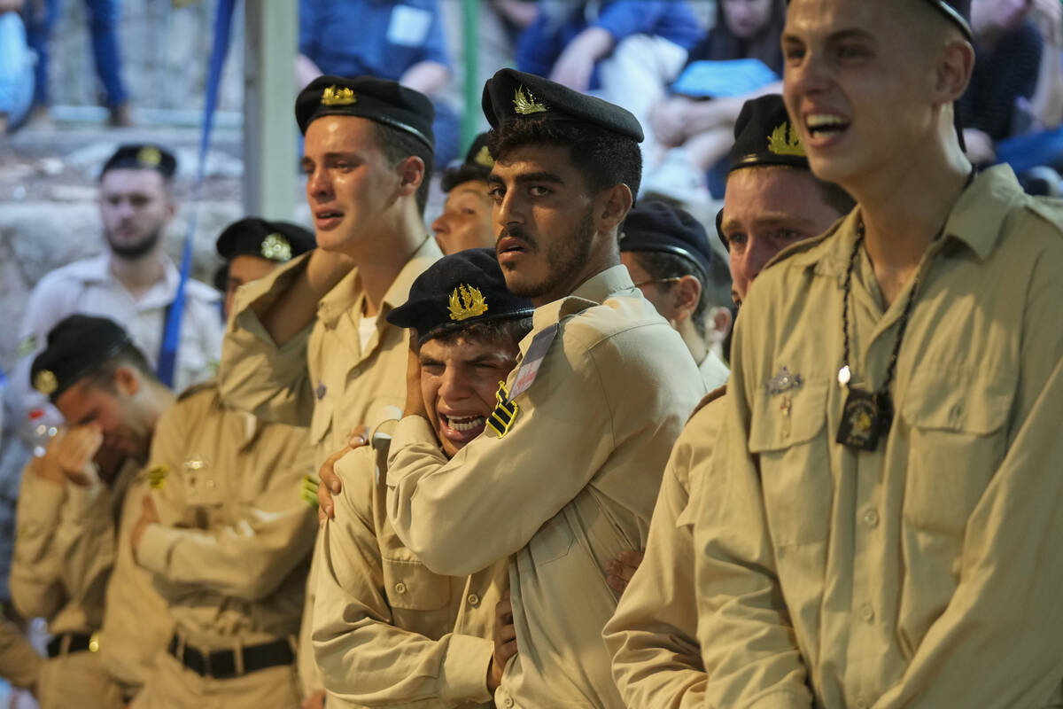 Israeli Navy sailors mourn during the funeral of Petty Officer 1st Class David Moshe Ben Shitri ...