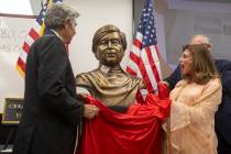 Artist Guillermo Salazar González, left, and Shelley Berkley, right, unveil the bust sculp ...