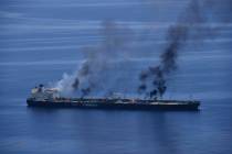 This photo released by the European Union's Operation Aspides shows fires burning aboard the oi ...