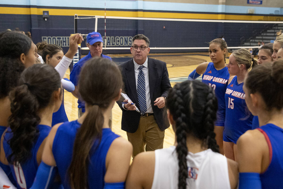 Bishop Gorman Head Coach Gregg Nunley talks to the team during the volleyball match against Foo ...