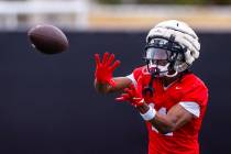 UNLV wide receiver Ricky White III (11) looks in a catch during the first day of football pract ...