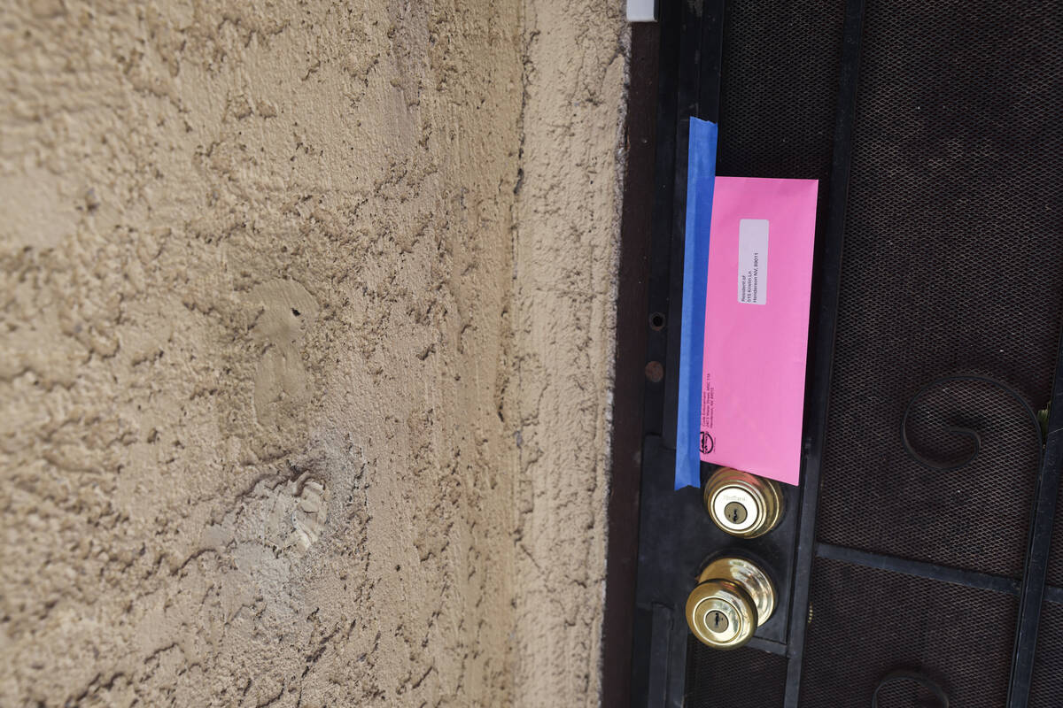 A notice from the city taped to a door in Somerset Park in Henderson, Tuesday, Aug. 27, 2024. R ...