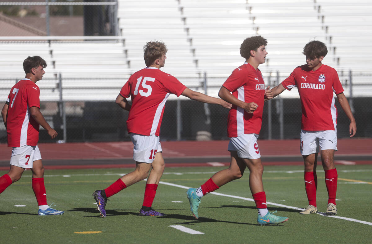 Coronado players celebrate a goal by Ben Aronow (15) during a soccer game against Cimarron-Memo ...