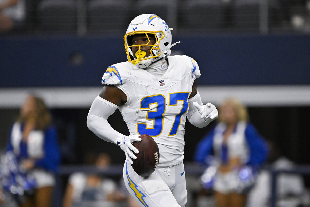 Los Angeles Chargers safety Thomas Harper (37) runs after an interception during a preseason NF ...