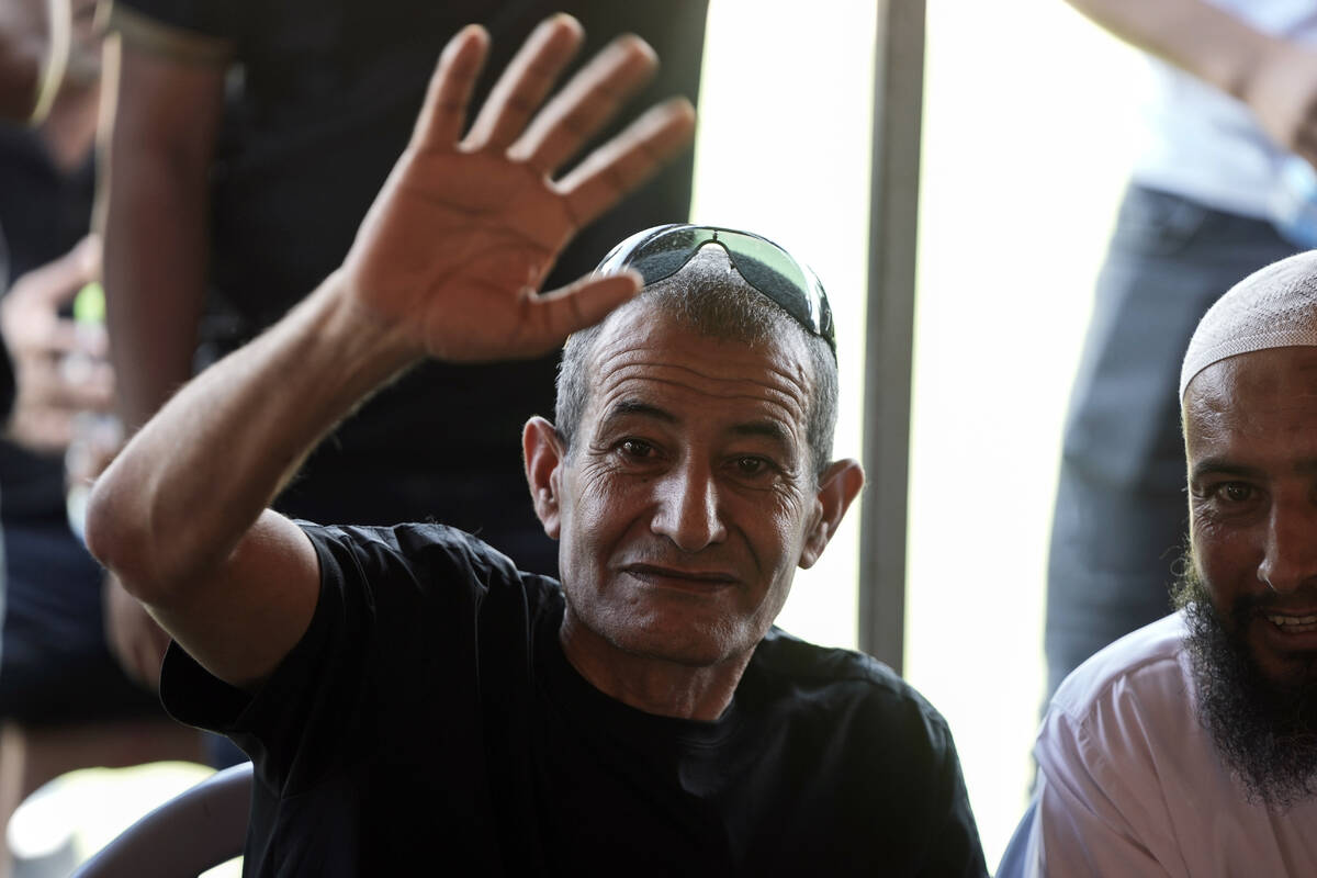 Qaid Farhan Alkadi, 52, who was held hostage by Hamas militants in Gaza Strip, waves to relativ ...