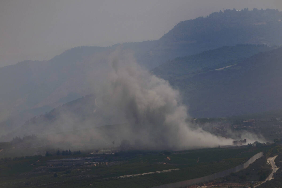 Smoke rises from an Israeli airstrike on Kfar Kila, a Lebanese border village with Israel in so ...