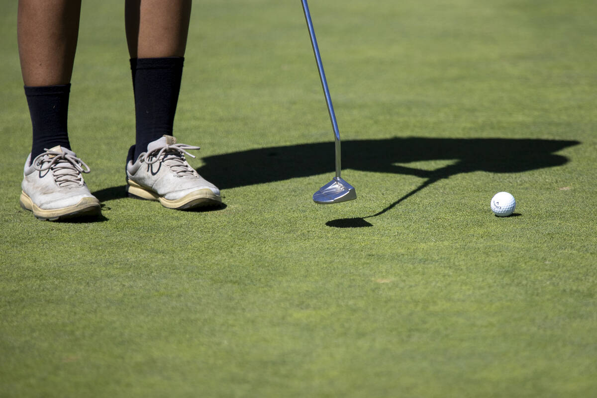 Clark’s Cameron Huang putts her ball during the Class 5A Mountain League girls golf matc ...