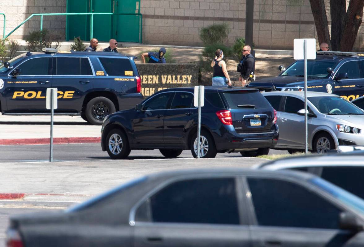 Clark County School District Police Department officers are seen outside of Green Valley High S ...