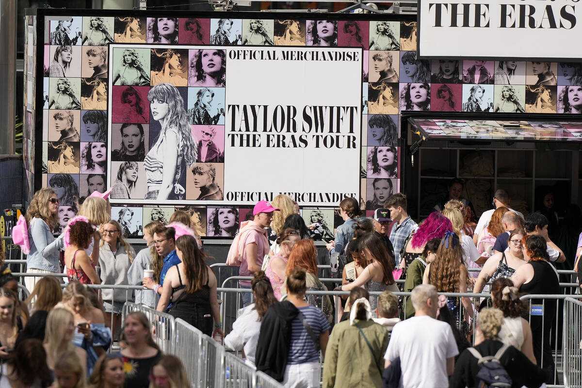 Fans of singer Taylor Swift, called Swifties, arrive at Wembley Stadium in London, Thursday, Au ...