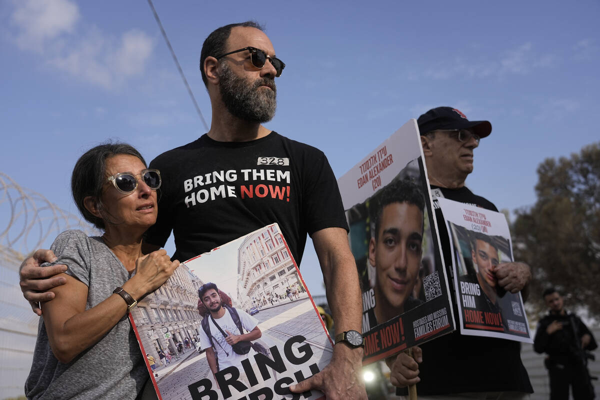 Rachel Goldberg, left, and Jon Polin center, parents of Israeli-American hostage Hersh Polin-Go ...