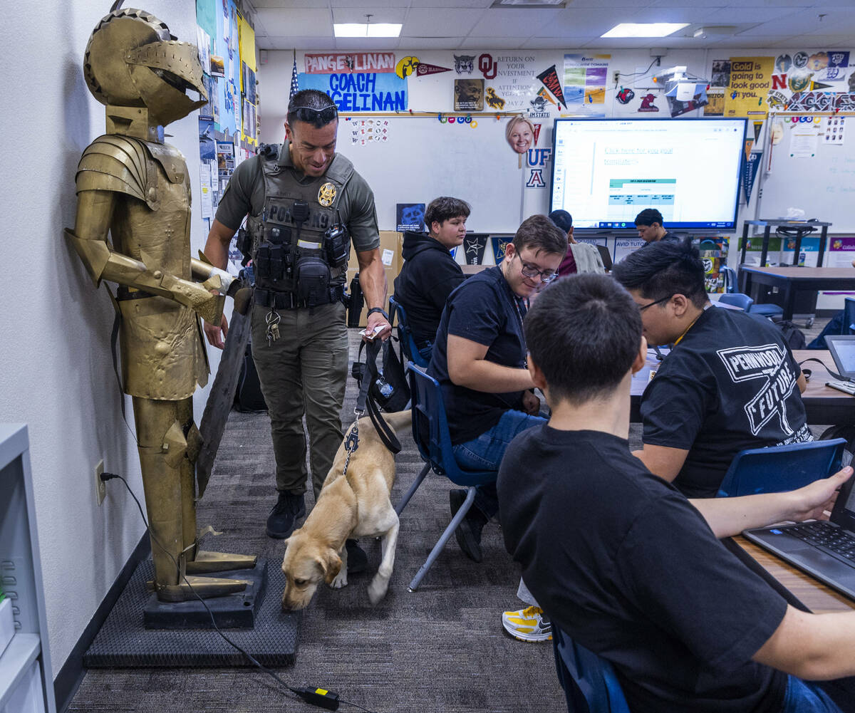 Clark County School District K-9 officer Steven Patty with his working dog Peppermint visit one ...