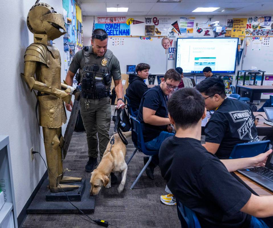 Clark County School District K-9 officer Steven Patty with his working dog Peppermint visit one ...