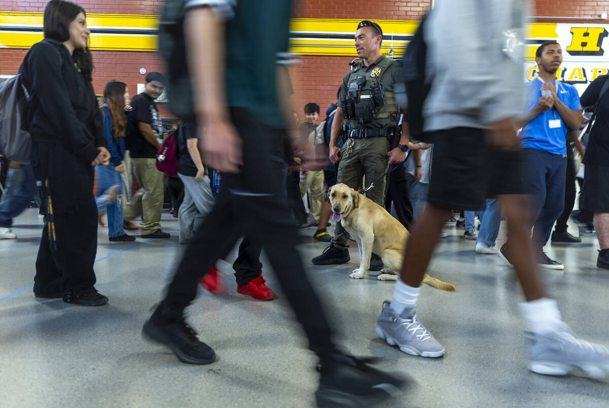 Clark County School District K-9 officer Steven Patty with his working dog Peppermint take a mo ...