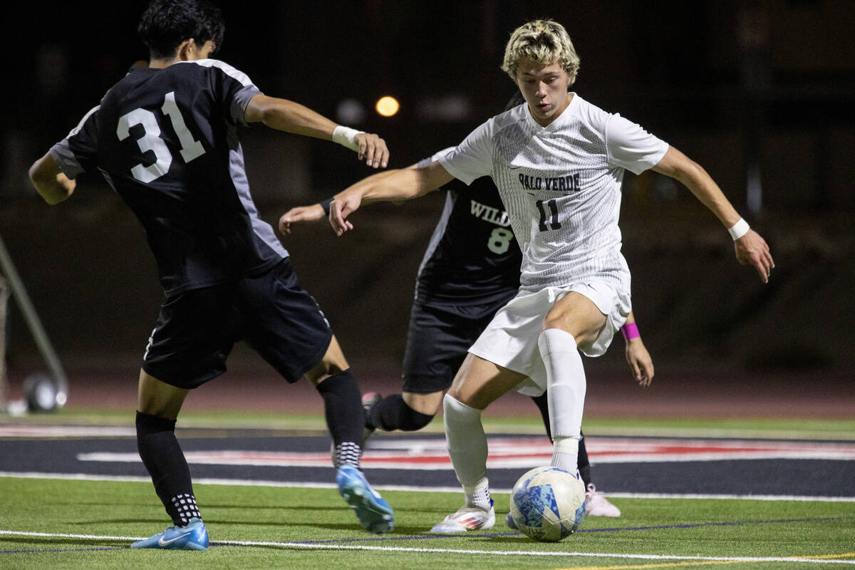 Palo Verde junior Noah Johnson (11) attempts to keep the ball during the high school soccer gam ...