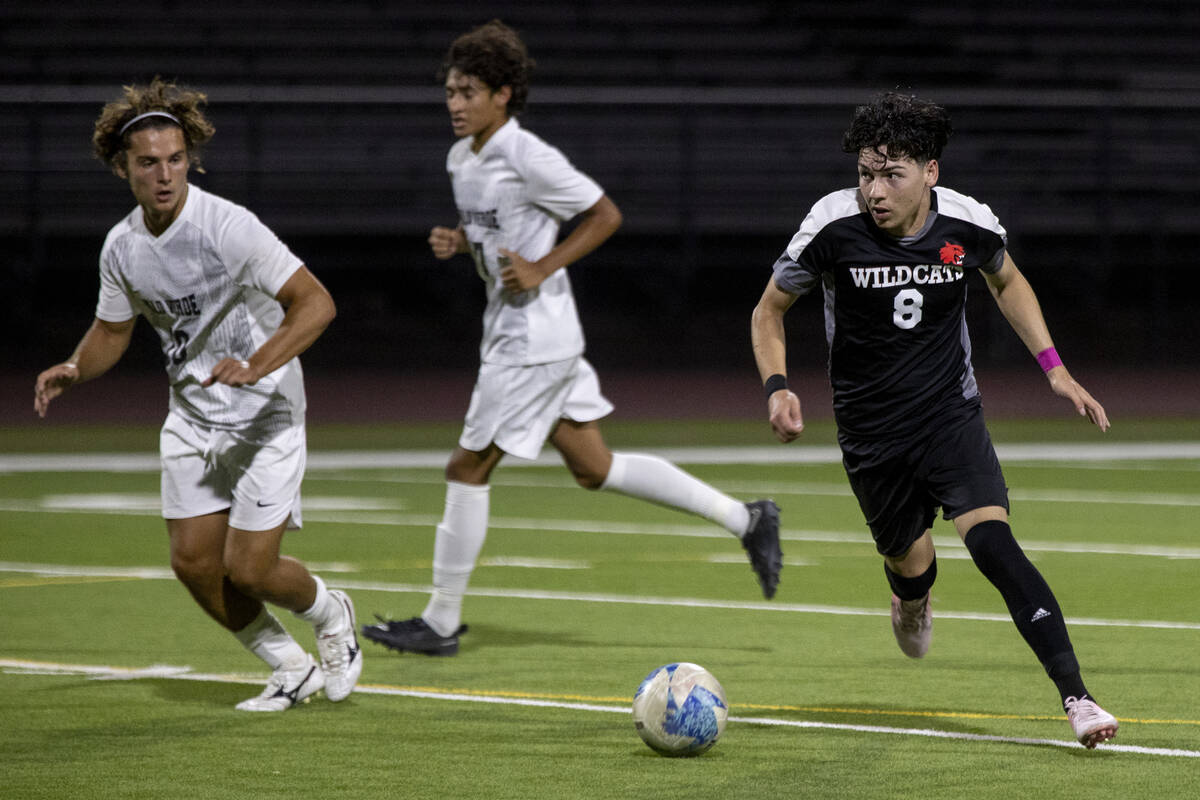 Las Vegas High senior Oscar Sandoval (8) competes during the high school soccer game against Pa ...