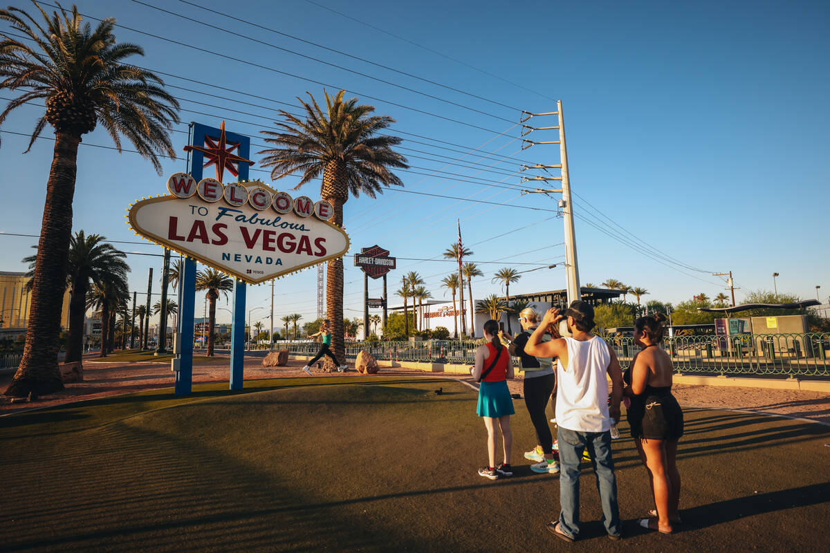 Tourists line up to take photographs at the “Welcome to Fabulous Las Vegas” sign despite th ...