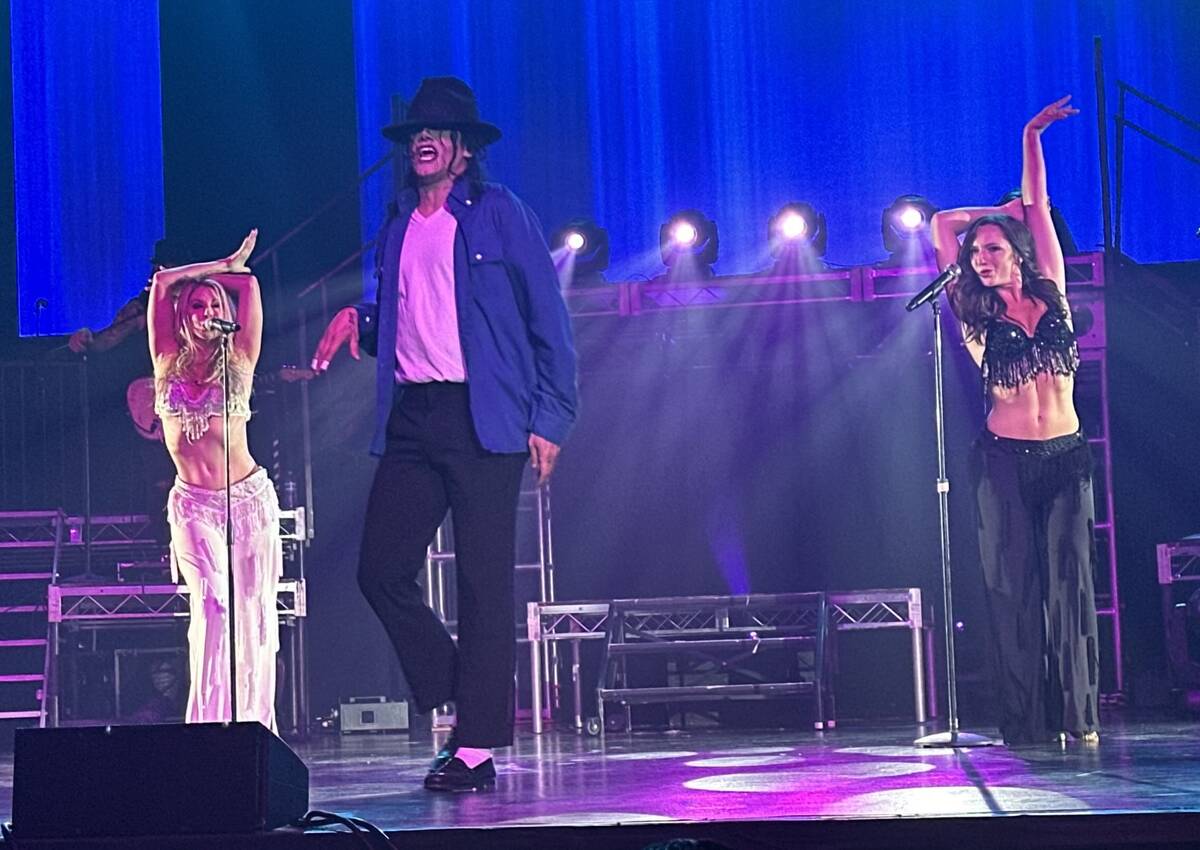 Michael Firestone, star of "MJ The Evolution," performs with backing dancers Sarah Clear, left, ...