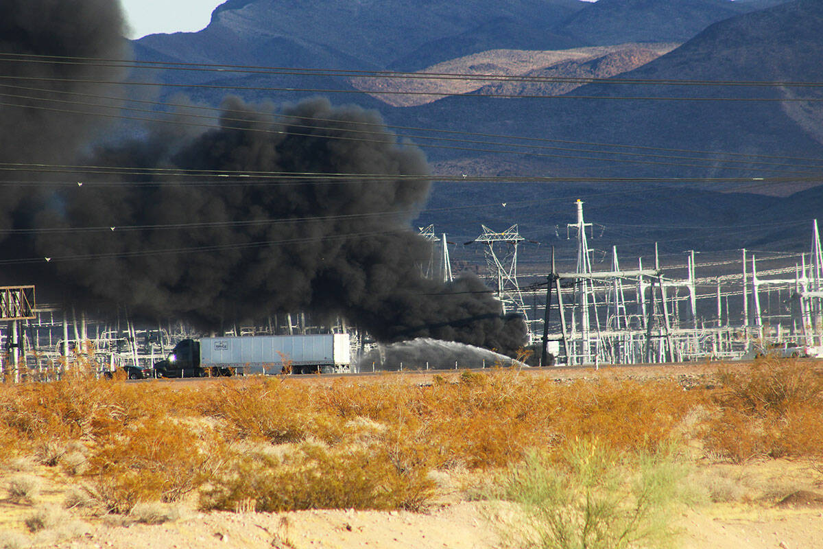 Fire crews work to extinguish a transformer fire near Interstate 11 on Thursday, Aug. 29, 2024, ...