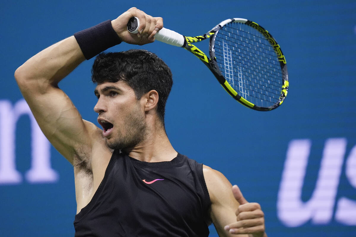 Carlos Alcaraz, of Spain returns a shot to Botic van de Zandschulp, of the Netherlands, during ...