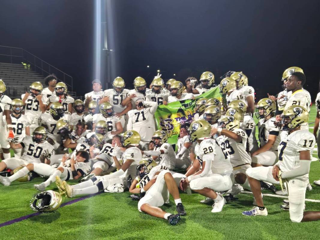 Spring Valley players celebrate after winning the "Banner Game" over Bonanza on Friday, Aug. 30 ...