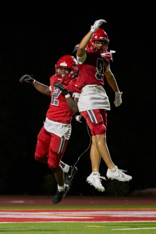 Arbor View running back Sean Moore (2) and wide receiver Kai Cypher (9) celebrate after Moore s ...