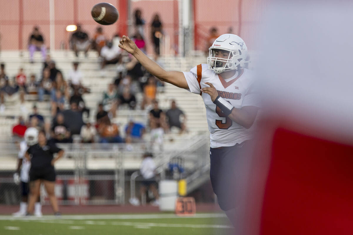 Legacy quarterback Aidan Crawford (9) throws the ball during the Class 5A high school ‘B ...