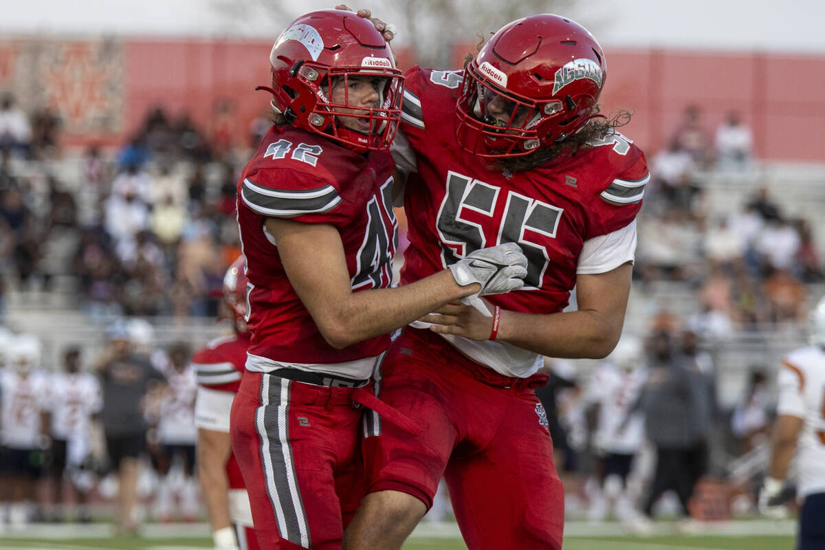 Arbor View linebacker Christian Thatcher (42) and Arbor View defensive lineman Kaden Compeau (5 ...