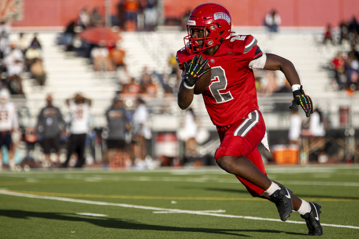 Arbor View running back Sean Moore (2) runs with the ball during the Class 5A high school &#x20 ...