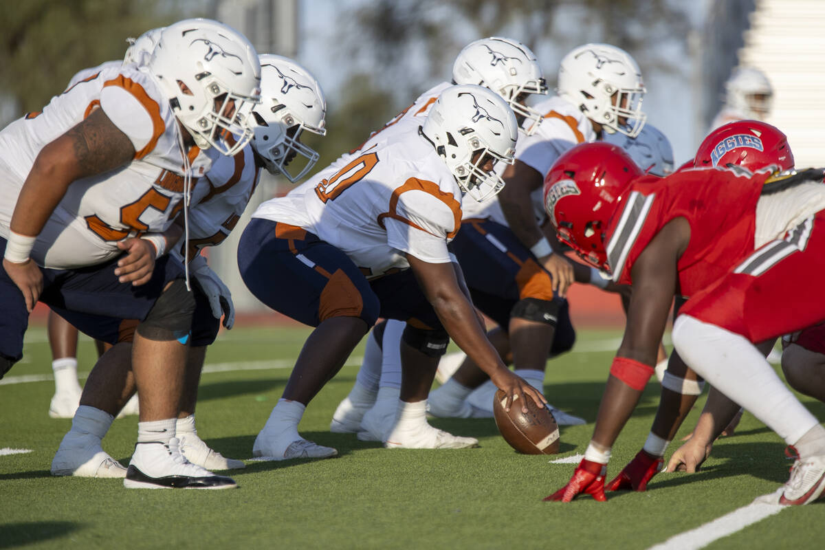 The Legacy offensive line prepares to snap the ball during the Class 5A high school ‘Bat ...