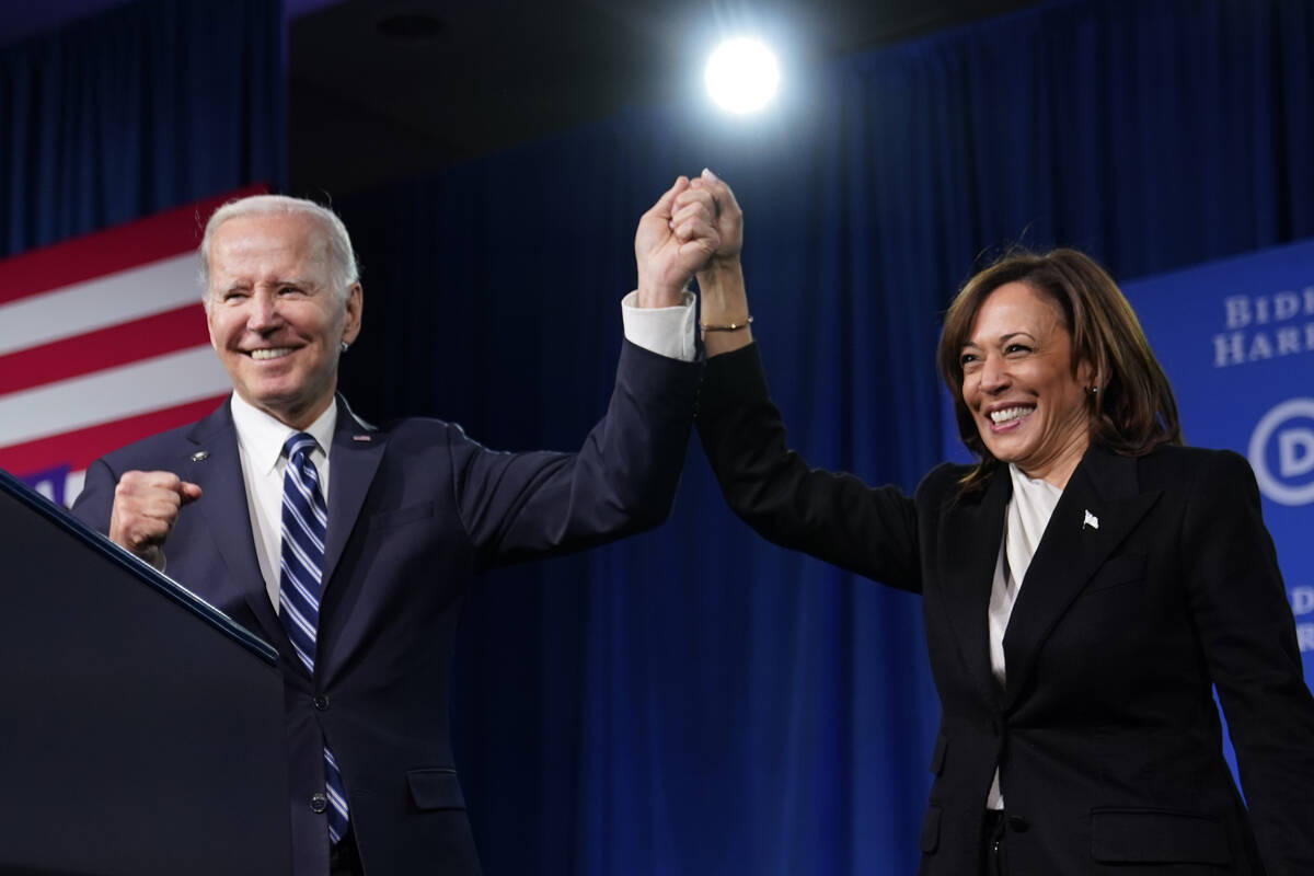 FILE - President Joe Biden and Vice President Kamala Harris stand on stage at the Democratic Na ...