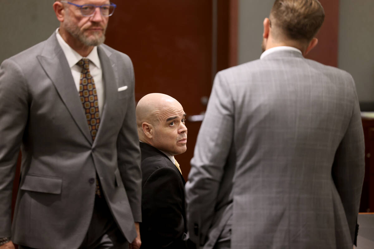 Robert Telles waits in court with his attorneys Robert Draskovich, left, and Michael Horvath du ...