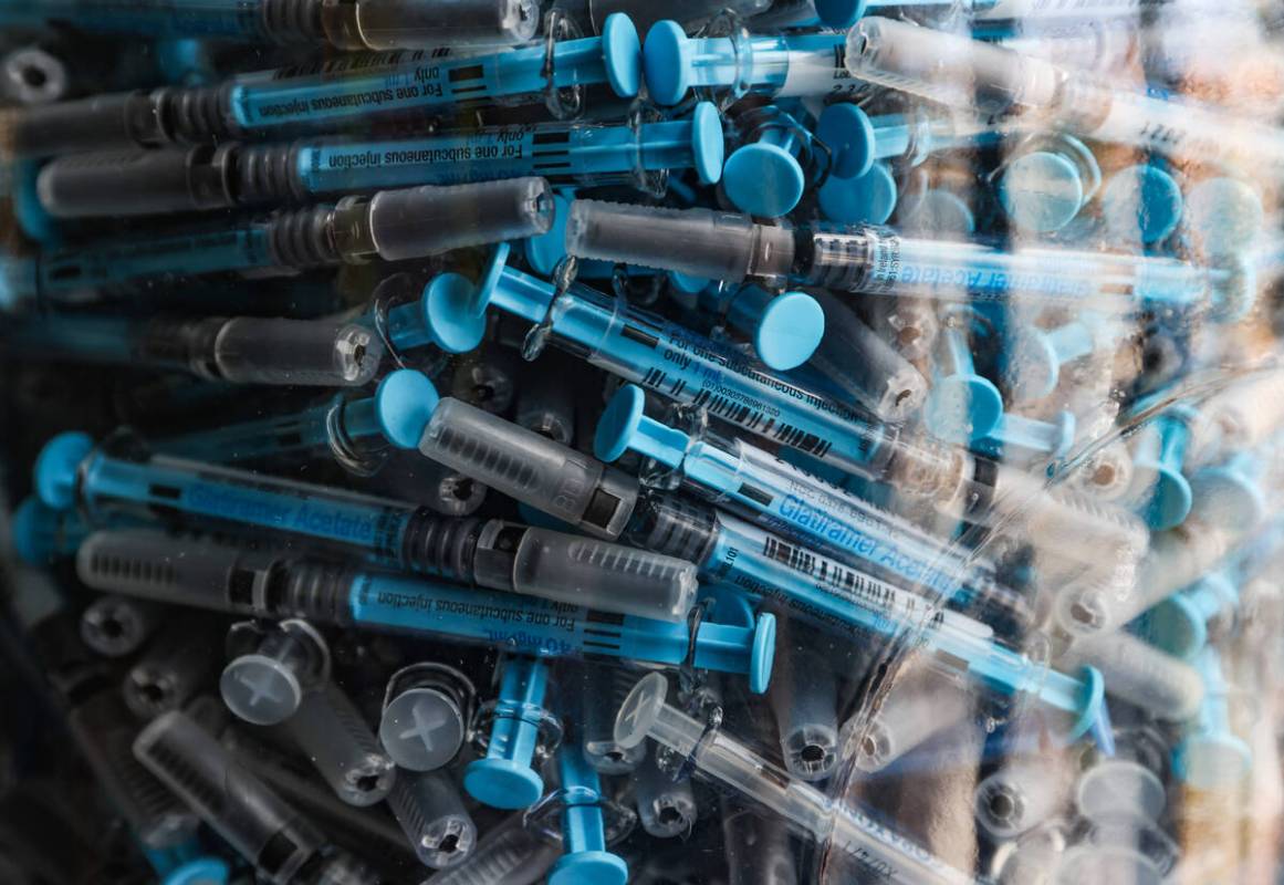 Syringes used for daily self-administered injections of multiple sclerosis drugs in a giant co ...