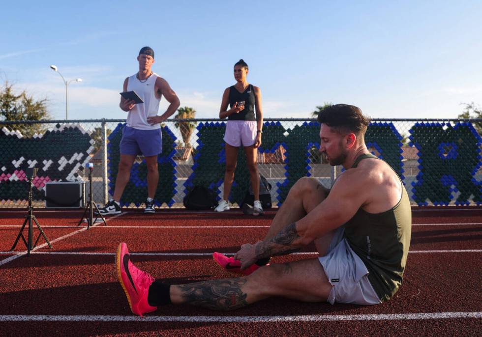 Aaron Hargreaves, left, and Taylor Koki, trainers with D1 Athletic Training Henderson, wait as ...