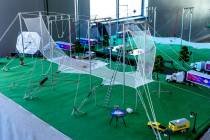 Renato Fernandes built a scale model of his backyard trapeze which he presented as a visual aid ...