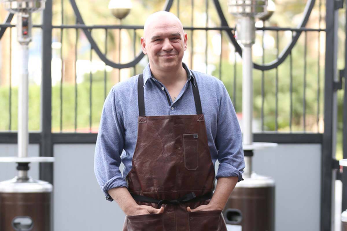 Michael Symon, chef and owner of Mabel's BBQ, poses for a photo at his restaurant at The Palms ...