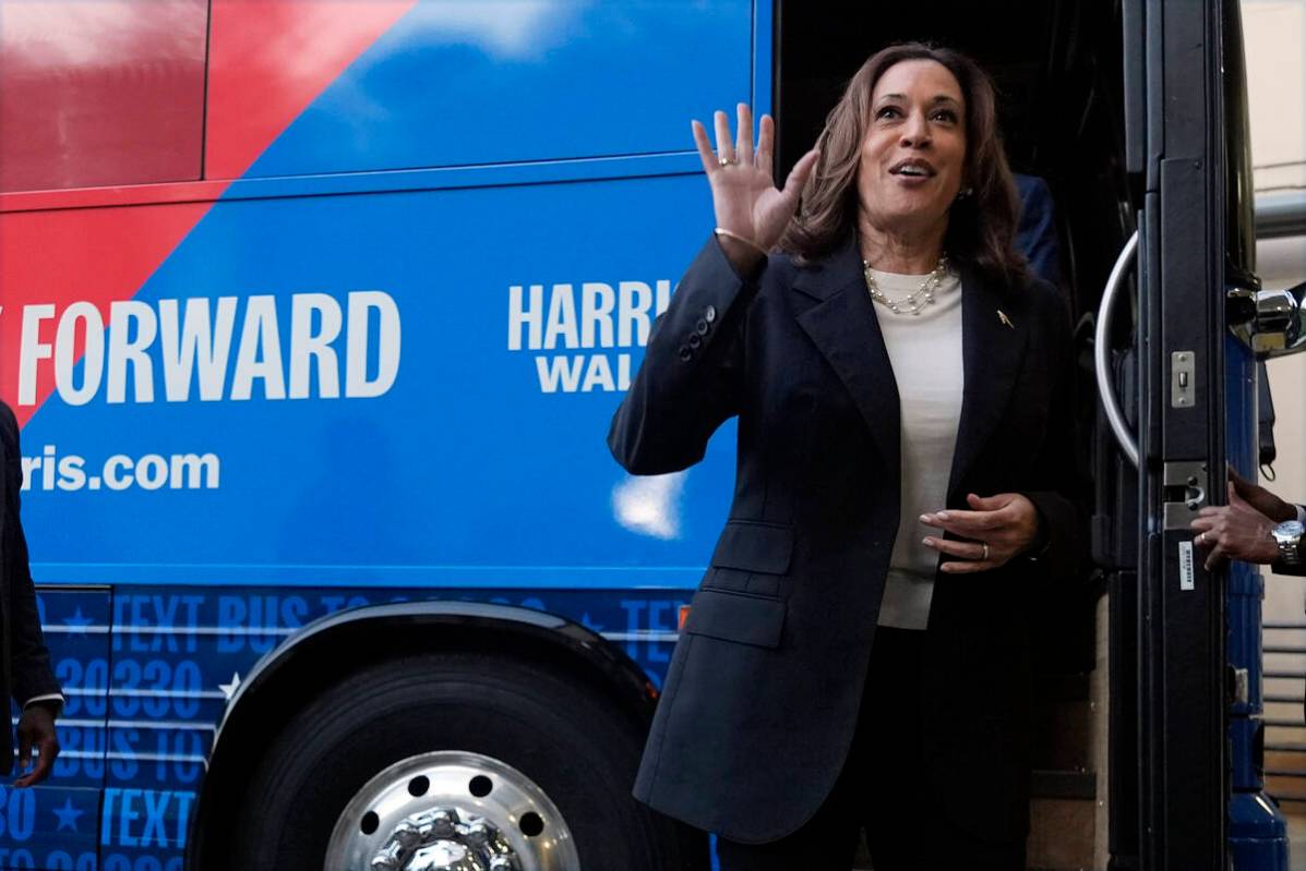 Democratic presidential nominee Vice President Kamala Harris waves as she exits her campaign bu ...