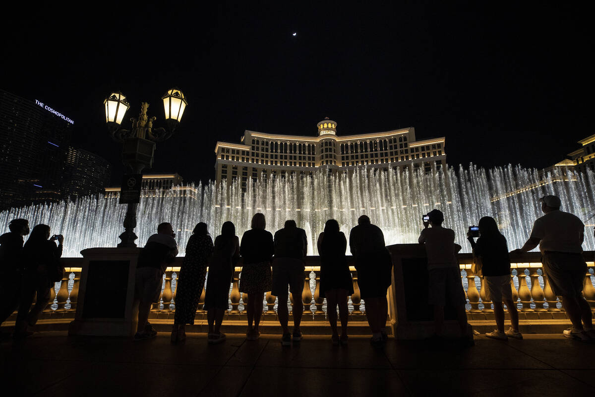 Visitors enjoy the Fountains of Bellagio show on March 19, 2021, in Las Vegas. (Las Vegas Revie ...