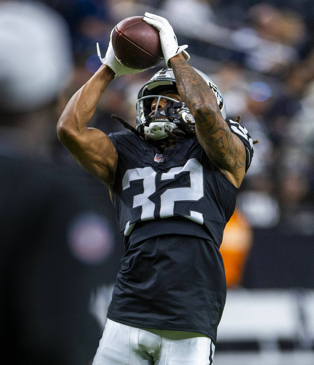 Raiders wide receiver Tyreik McAllister (32) catches a pass as they face the Dallas Cowboys for ...