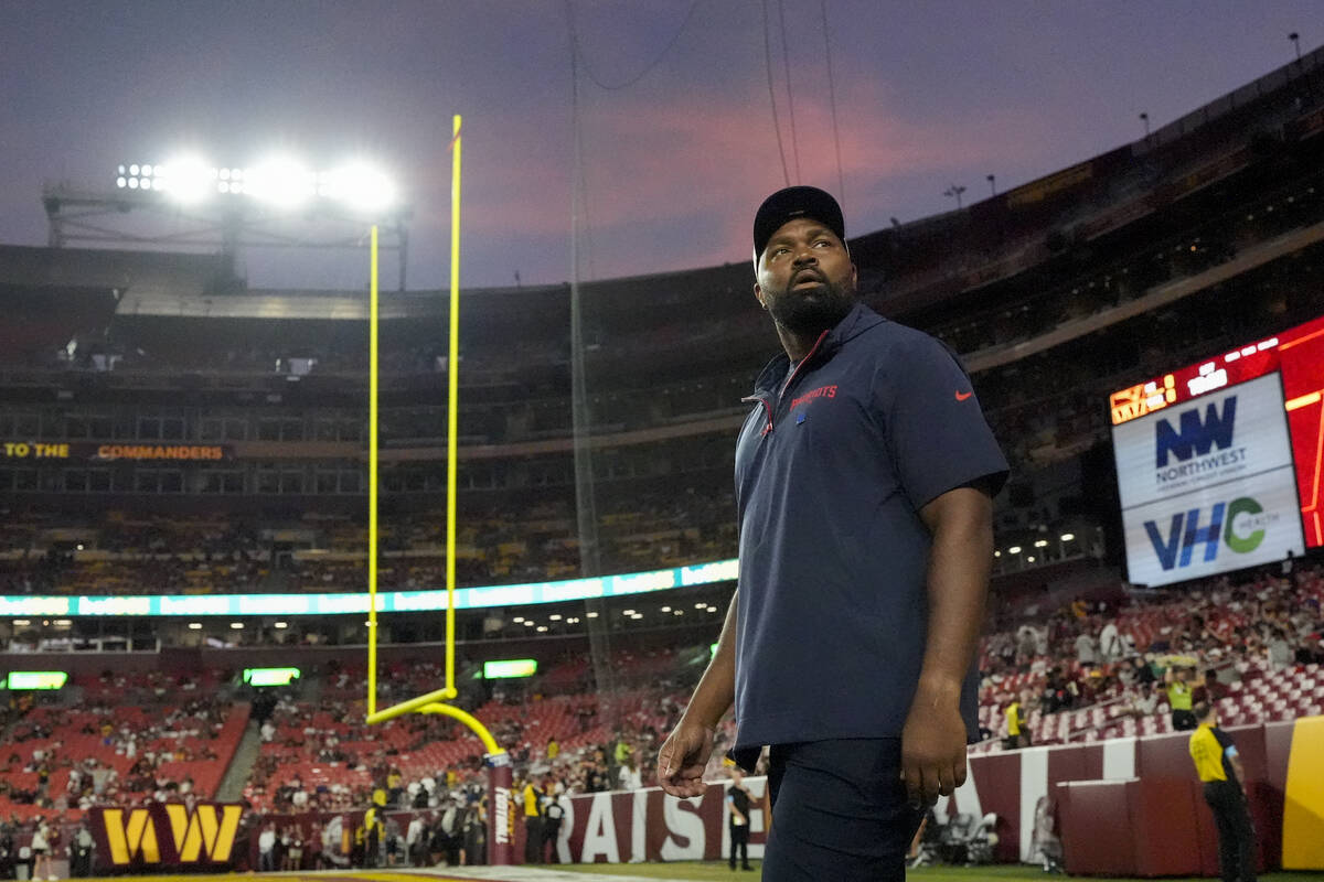 New England Patriots head coach Jerod Mayo walks onto the field before an NFL preseason footbal ...