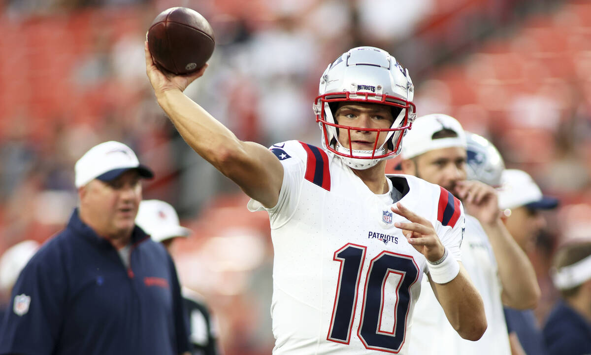 New England Patriots quarterback Drake Maye (10) throws before an NFL football game against the ...