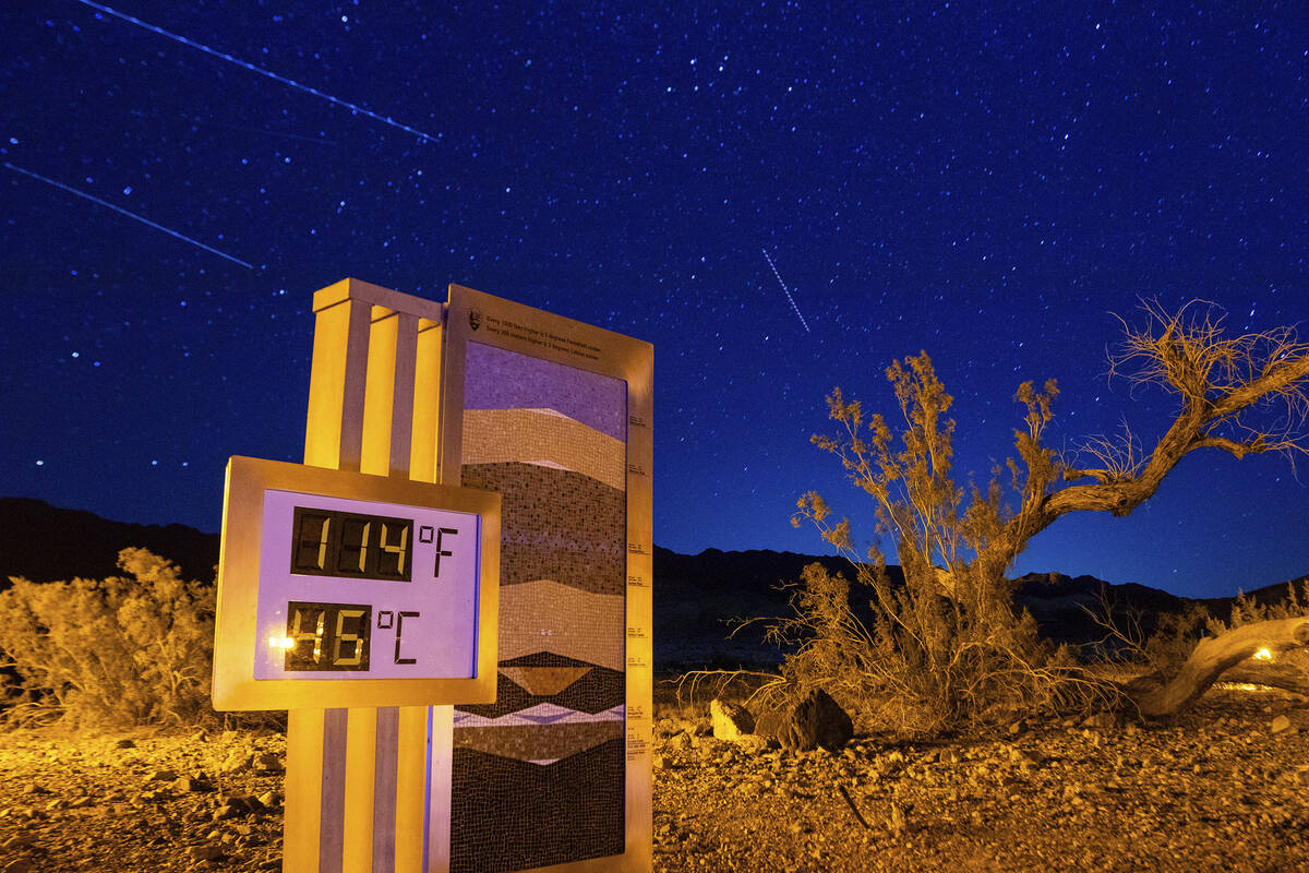 FILE - A long exposure image shows the recorded temperature on a thermostat at the Furnace Cree ...