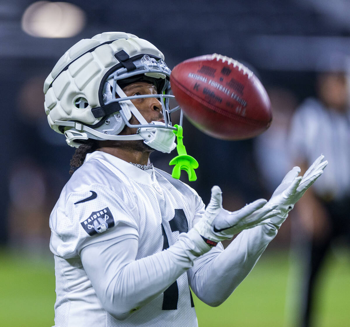 Raiders wide receiver Tre Tucker (11) reaches out for a punt return during an open practice at ...