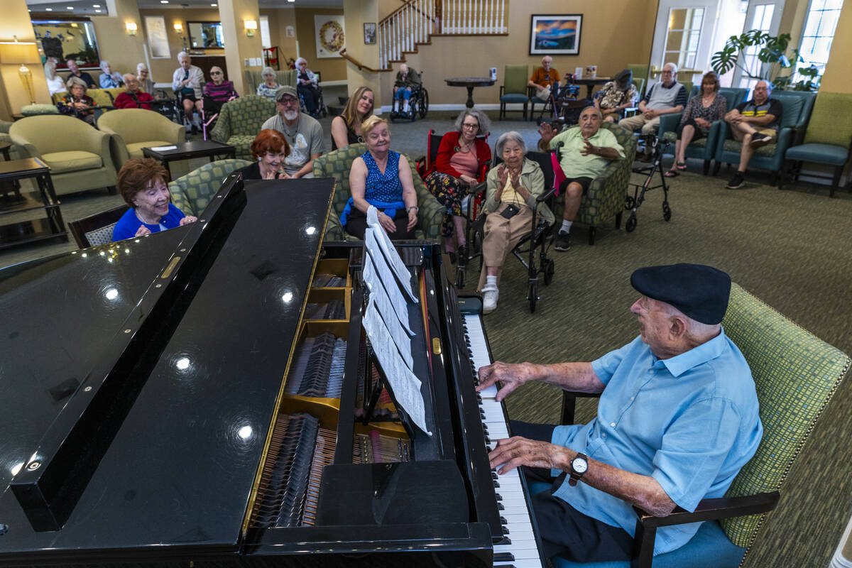 95-year-old pianist Don "Pops" Friend sings to his audience as he plays his finale at ...